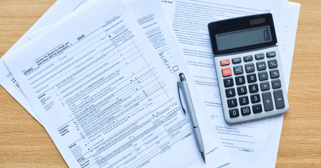 Why Professional Tax Preparation Saves More Than It Costs 1 Professional tax preparation with calculator, pen, and IRS forms on desk – expert CPA services by Meinershagen & Co. in Missouri and Kansas.