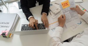 Tax and Accounting Services by Meinershagen & Co 3 Accountant calculating estimated payments and developing a tax plan that minimizes penalties using detailed financial reports.