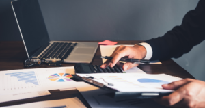 Business owner reviewing financial forecasting, cash flow projections, and growth planning data
